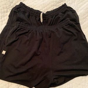 Two pairs of black Vuori shorts
